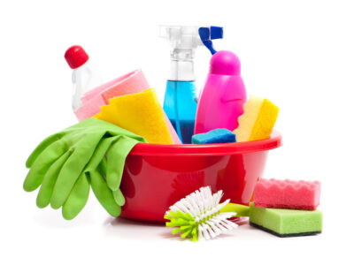 full box of cleaning supplies and gloves isolated on white